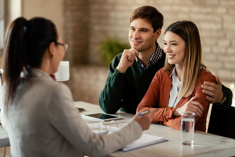 A couple learning about first-time homebuyer programs