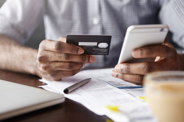 Person holding a credit card
