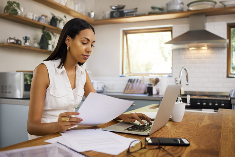 Women working on calculating closing costs