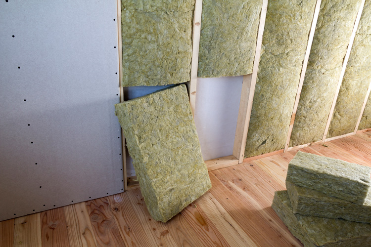 Insulation being replaced behind wall.