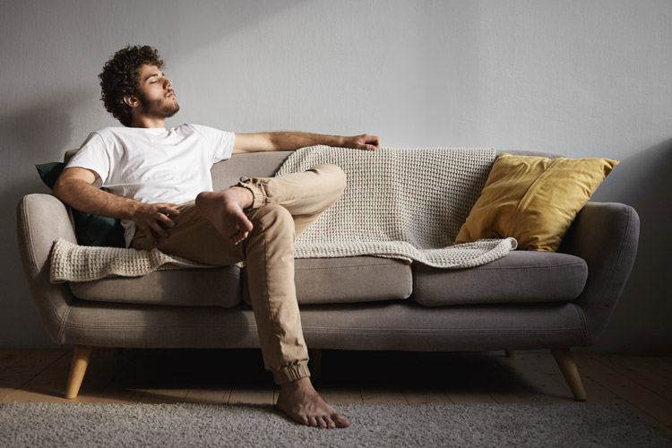 A man sitting on a couch.