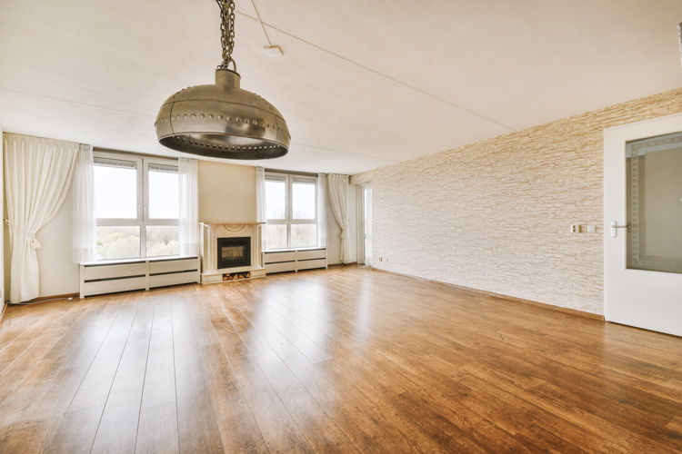 New hardwood floors in a spacious room.