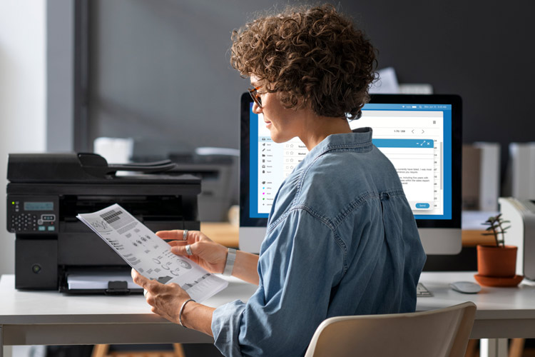 A person digitizing their paperwork