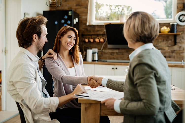 Real estate agent with clients