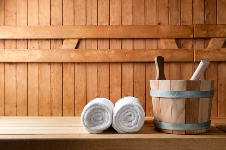 Sauna with towels and bucket