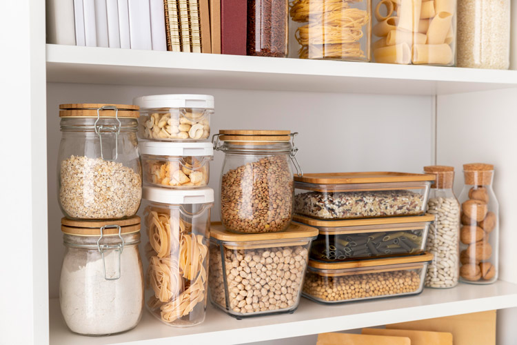 A well organized pantry with food in clear containers