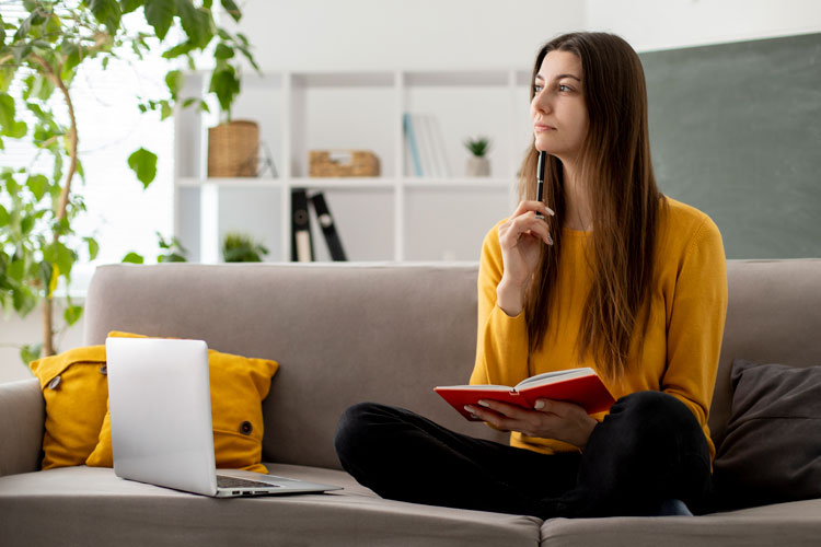 Woman considering which home she'll buy