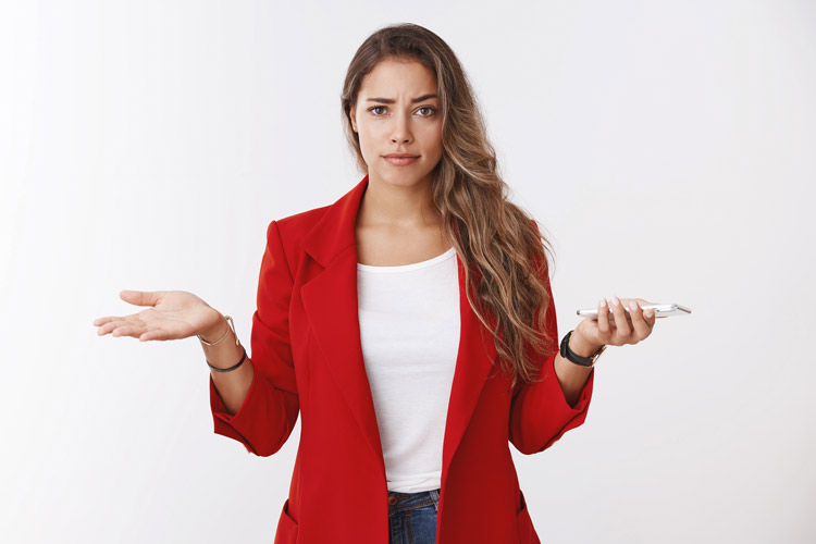 Woman in red blazer holding a cell phone