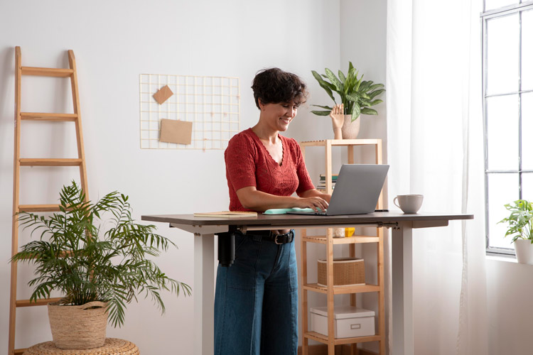 Woman standing at a standing desk