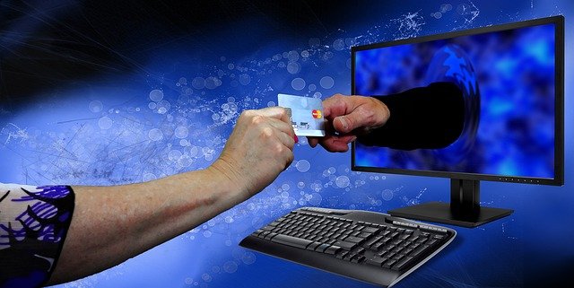 Hands Holding Credit Card